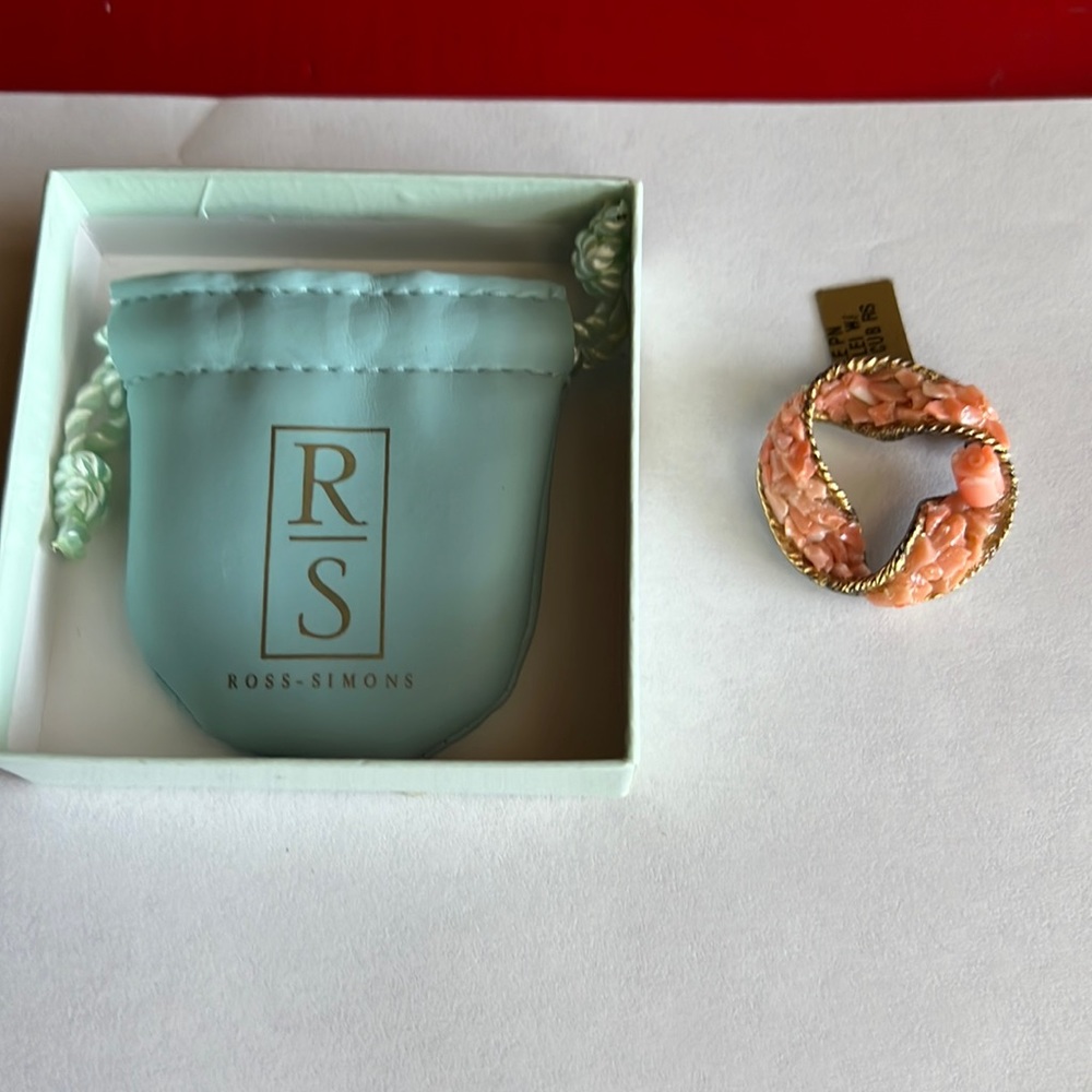 Coral pin with a rose sticking up from Ross Simons.